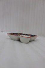 Square ceramic Marrakech serving platter with intricate colorful mosaic patterns and an attached side dip bowl on a wooden countertop.