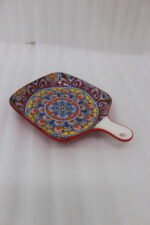 6.5-inch decorative Marrakech square ceramic serving platter with intricate mandala pattern and handle on a wooden countertop