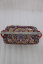 Vibrant 13-inch decorative Marrakech ceramic serving dish with colorful mosaic patterns and built-in side handles displayed on a wooden countertop.