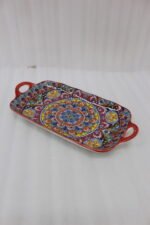 Vibrant 13-inch decorative Marrakech ceramic serving dish with colorful mosaic patterns and built-in side handles displayed on a wooden countertop.
