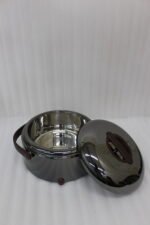 Three modern mirror-finish stainless steel insulated hot pots with wooden arch handles on a kitchen countertop.
