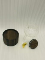 3.2L fluted amber glass beverage dispenser with wooden lid, wooden base, and gold spigot on a kitchen counter