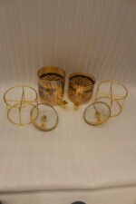 Luxury amber glass beverage dispenser with intricate blue pattern on a decorative gold metal stand