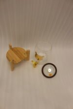 3.6-liter clear glass drink dispenser featuring a gold bear face design, gold spigot, and sturdy wooden stand set on a kitchen counter