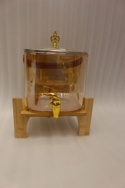 6.5L amber shaded glass beverage dispenser with gold spigot on a wooden stand