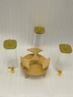 Triple glass beverage dispenser set featuring gold spigots, gold decorative lids, and a wooden rotating stand on a kitchen countertop.