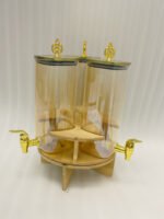 3-piece amber shaded glass beverage dispenser set with gold spigots on a wooden stand