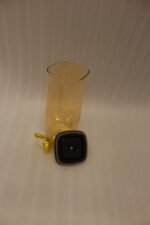 3-piece amber shaded glass beverage dispenser set with gold spigots on a wooden stand