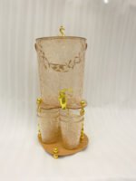 Elegant pink acrylic beverage dispenser with gold swan finial, gold spigot, stand, and 6 matching diamond-cut glasses.