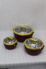 3-piece luxury insulated hotpot set in ribbed maroon with gold rims and clear glass lids on a granite kitchen countertop.