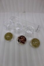 3-piece clear acrylic jar set with patterned dome lids, clear spoons, and serving tray on a kitchen countertop