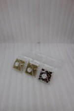 3-piece clear acrylic spice and dry fruit jar set with patterned lids, crystal knobs, and clear tray on marble kitchen counter