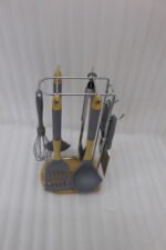 8 pcs grey silicone cooking utensils set with wooden handles hanging on a stainless steel stand with wooden base