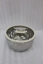 10 piece stainless steel mixing bowl set with clear glass lids sitting on a marble kitchen countertop