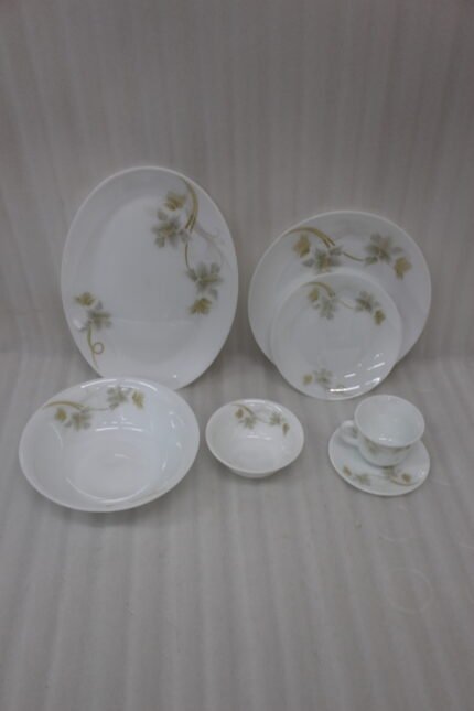 Printed 32 piece white marble ceramic dinnerware set featuring elegant floral patterns displayed on a kitchen counter