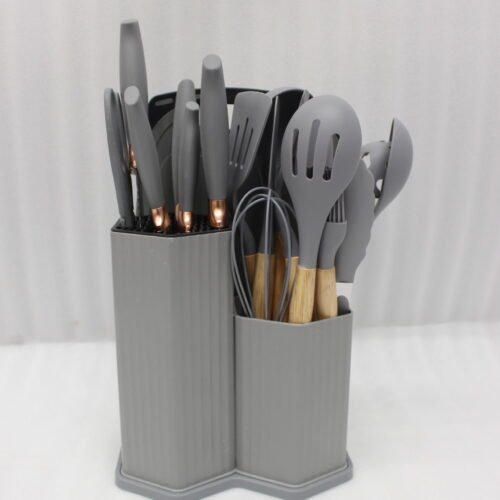 Grey 19-piece silicone kitchen utensil and knife set with wooden handles in a matching grey dual-compartment storage block.