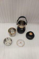Matte black portable insulated lunch box jar with gold trim accent and black top handle on a kitchen counter