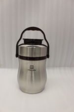 AILIJIN insulated stainless steel lunch box container with a dark brown carrying handle sitting on a modern kitchen countertop.