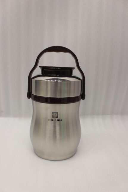 AILIJIN insulated stainless steel lunch box container with a dark brown carrying handle sitting on a modern kitchen countertop.