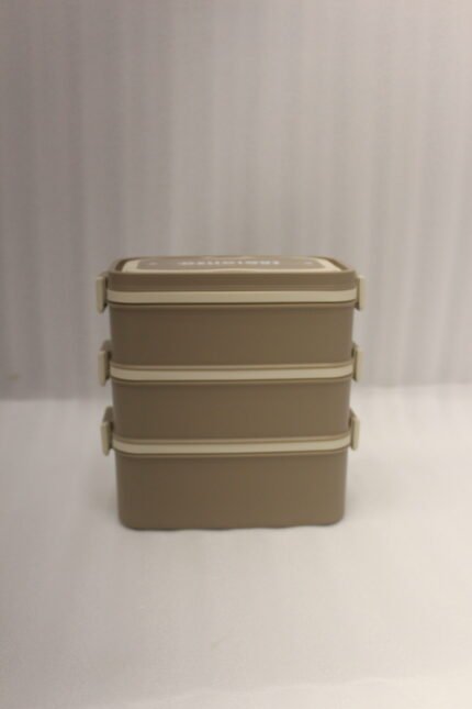 3-in-1 multi-tier beige and brown lunch box stacked on a kitchen countertop