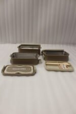3-in-1 multi-tier beige and brown lunch box stacked on a kitchen countertop