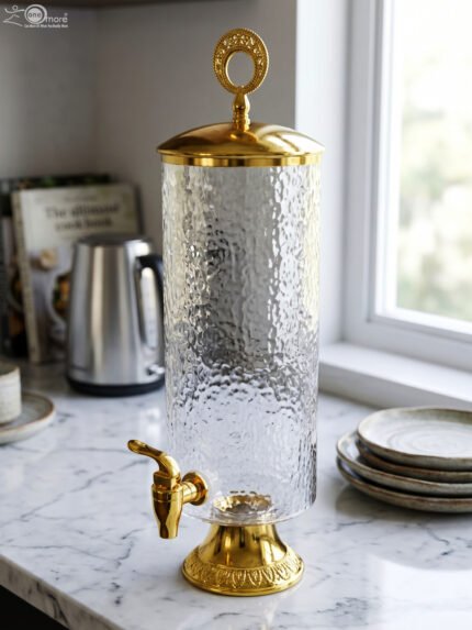 3.5 liter hammered clear glass beverage dispenser with ornate gold base, top ring lid, and gold tap on a marble countertop