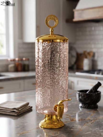 3.5-liter clear hammered glass beverage dispenser with polished gold lid ring handle and spigot on a kitchen counter
