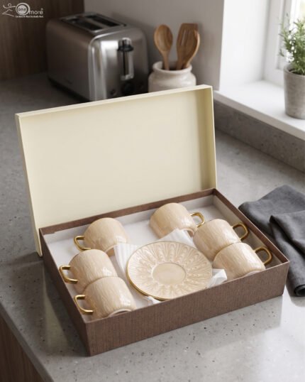 6-piece cream beige textured ceramic tea cup and saucer set with gold handles packaged in a brown gift box
