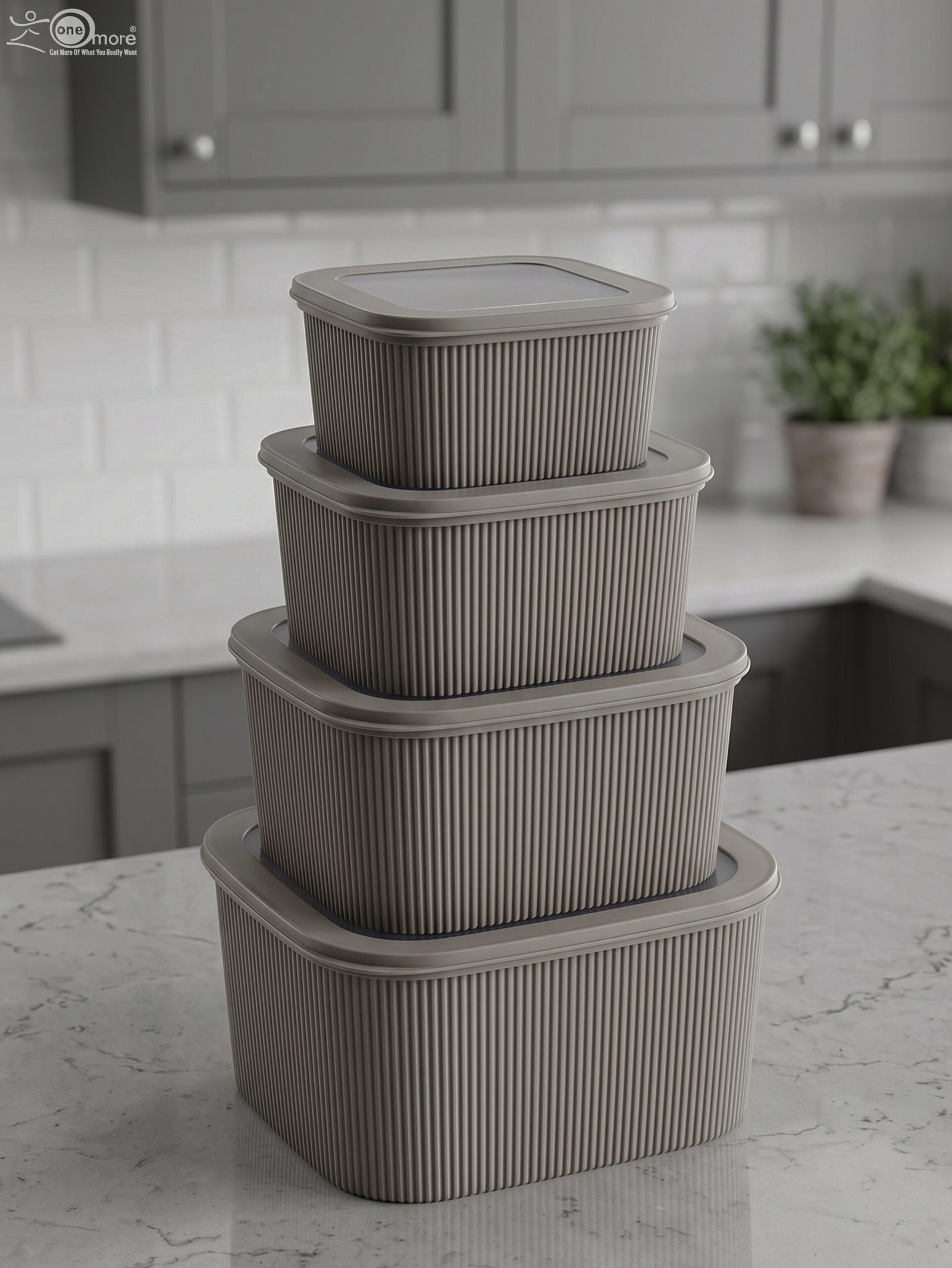 1 Stacked 4-piece ribbed grey plastic storage box set with fitted lids on a marble kitchen countertop.