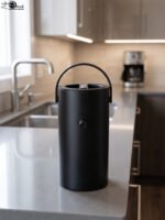 Matte black 2L bumper buffet burner holder with top handle placed on a kitchen countertop