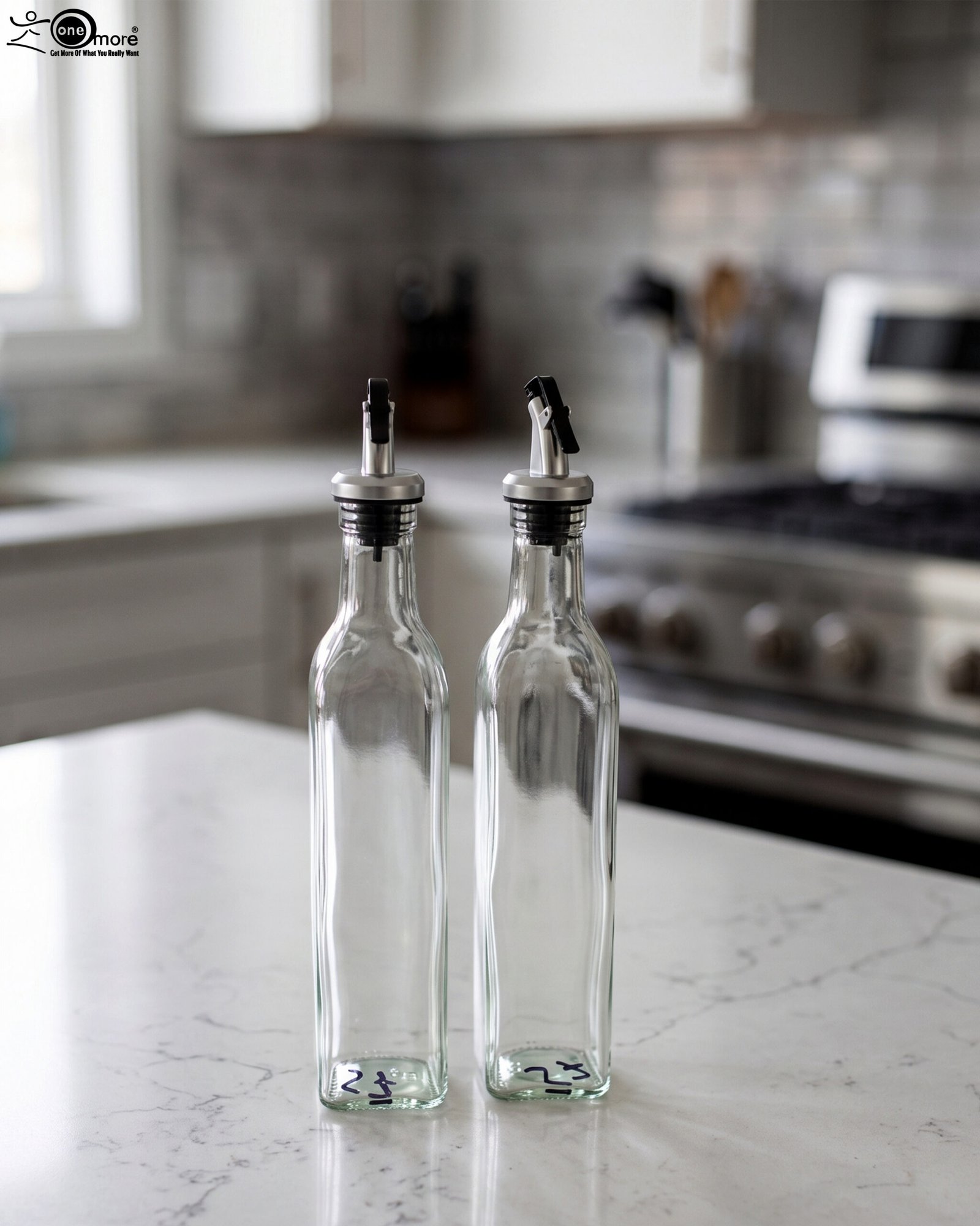 1 2 Pcs transparent glass oil dispenser bottles with stainless steel leak-proof pour spouts set on a marble kitchen counter