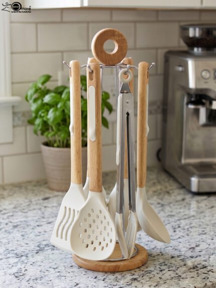7 piece white silicone kitchen utensil set with natural wooden handles hanging on a chrome stand
