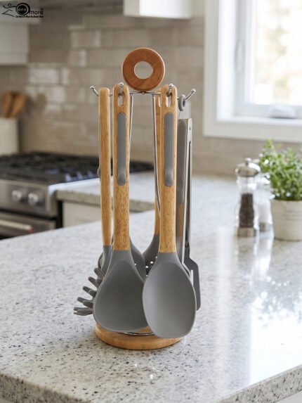 7 piece silicone cooking utensil set with wooden handles on a rotating stand