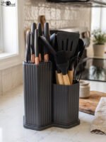 Matte dark grey 19-piece kitchen utensil and knife block set with rose gold accents and wooden handles on a marble countertop.