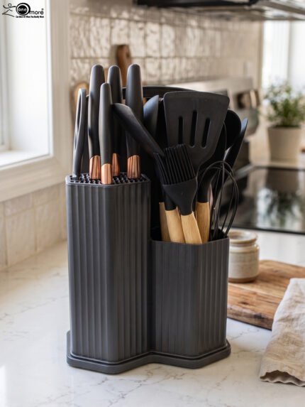 Matte dark grey 19-piece kitchen utensil and knife block set with rose gold accents and wooden handles on a marble countertop.