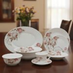 38 piece opal glass dinner set with vintage floral rose patterns on a wooden dining table