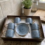 Luxury blue ceramic 6-person cup and saucer set with gold trim and textured pattern neatly packed in a gift box