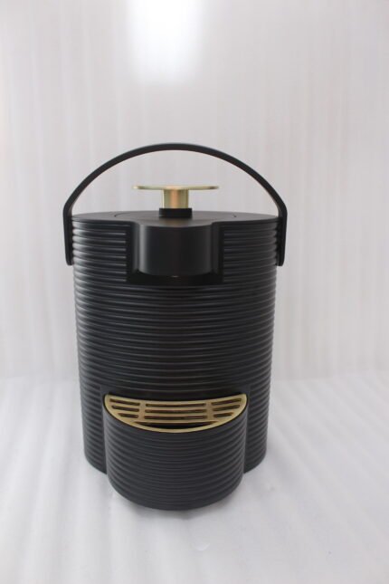 Modern ribbed matte black 2-liter hot water dispenser with gold top button, carrying handle, and gold drip tray on a kitchen countertop.