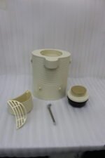 Modern cream-colored 2L ribbed water dispenser pitcher with gold accents and carrying handle on a marble kitchen countertop.