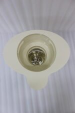 Modern cream-colored 2L ribbed water dispenser pitcher with gold accents and carrying handle on a marble kitchen countertop.