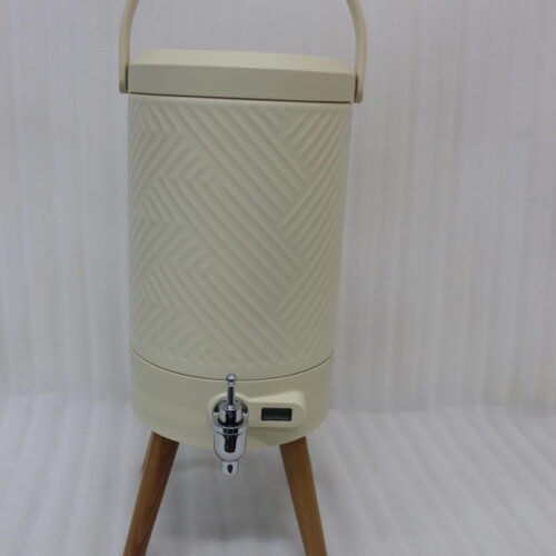 Modern 5L cream beverage dispenser with wooden legs, digital temperature display, and chrome spigot sitting on a marble kitchen countertop.