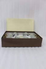 6-piece seafoam green ceramic tea cups with gold handles and matching saucers in a gift box