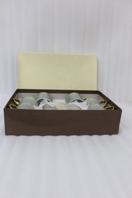 6-piece seafoam green ceramic tea cups with gold handles and matching saucers in a gift box