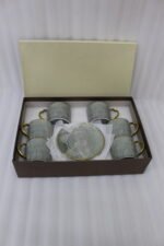 6-piece seafoam green ceramic tea cups with gold handles and matching saucers in a gift box