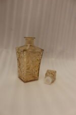 Amber-tinted 7-piece glass decanter and drinking glass set with diamond geometric texture on a marble countertop