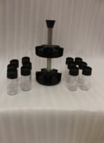 2-tier revolving spice rack set with clear glass jars and black caps on a granite countertop