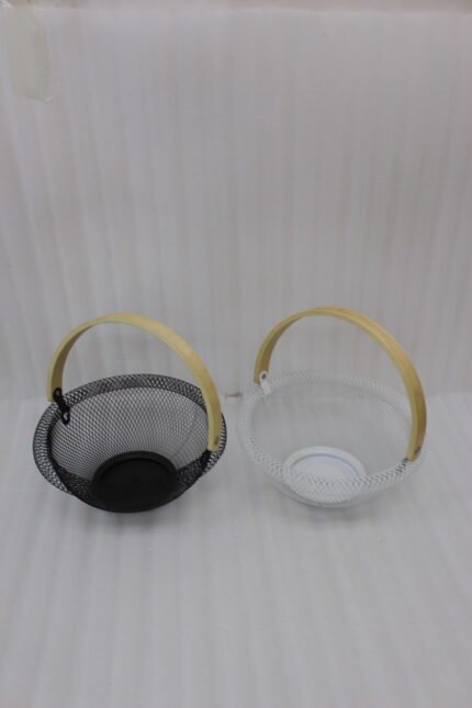 Black and white double wall mesh fruit baskets with wooden handles on a wooden countertop.