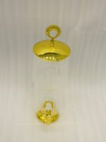 Luxury 3.5 liter ribbed glass beverage dispenser with ornate gold lid handle and gold spigot on a marble countertop