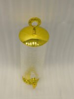 Luxury 3.5L amber ribbed glass beverage dispenser with ornate gold base, spigot, and lid handle on a kitchen countertop.