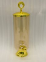 Luxury 3.5L amber ribbed glass beverage dispenser with ornate gold base, spigot, and lid handle on a kitchen countertop.